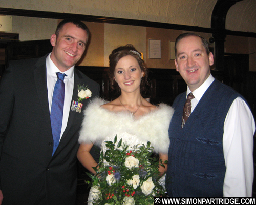 Wedding singer Simon Partridge with Tom and Rachael