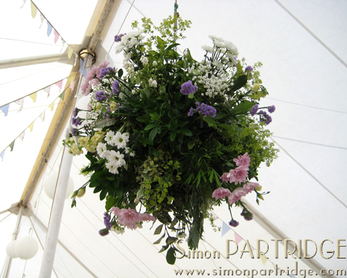 Floral "chandelier" in the wedding marquee